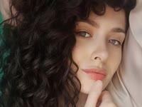 Dark curls, grey eyes and a sweet smile. That